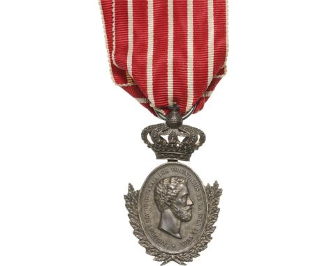 Medal for the Volunteers of the Isle of Cuba,1871 Breast Badge, 51x31 mm, Silver, crown suspension, ring and ribbon. Very rar