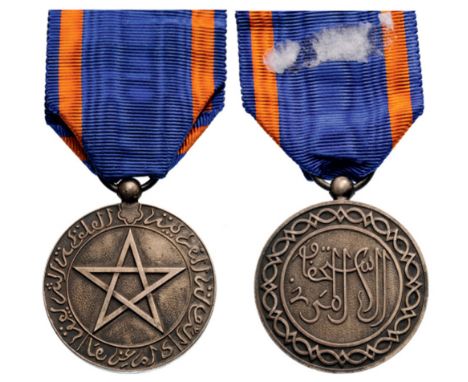 Cherifian Medal of Civil Merit, instituted in 1924 Breast Badge, 34 mm, silvered bronze, original suspension ring and ribbon.