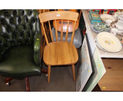 A set of three beech stick back dining chairs