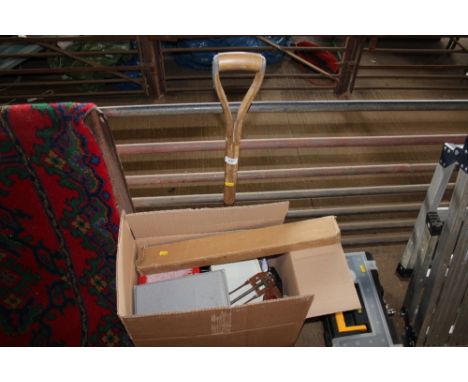 A box of tools together with a spade