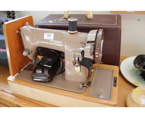 A Singer sewing machine (sold as collector's item) 