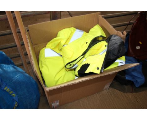 A Dickies large high vis jacket with various tools