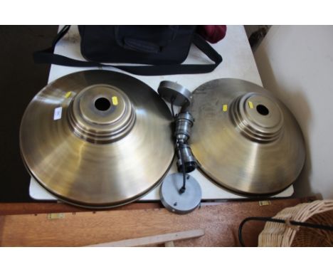 A pair of metal light fittings 
