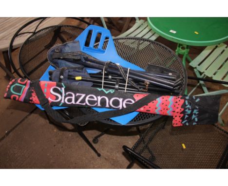 An abdominizer; folding stools and a hockey stick