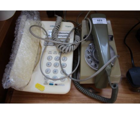 A rotary dial telephone and one other 