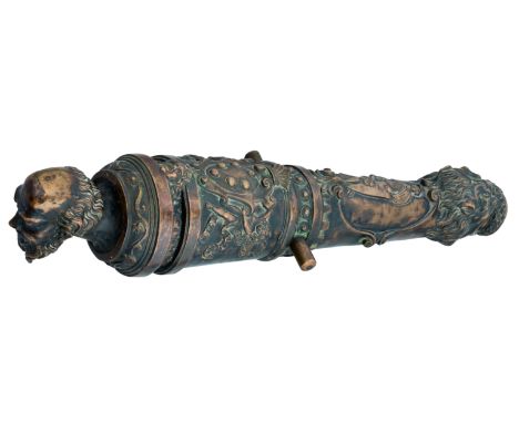 A BRASS CANNON IN THE STYLE OF COSIMO CENNI, MODERN after the Bargello cannon, of embossed sheet brass, the muzzle engulfed b