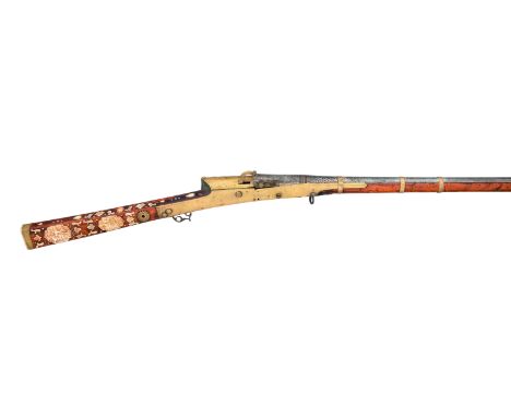 ˜A FINE 20 BORE INDIAN MATCHLOCK GUN (TORADOR), EARLY 19TH CENTURY with tapering swamped sighted barrel of pattern-welded iro