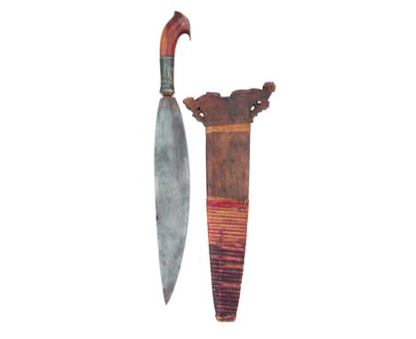 A PHILIPPINES MACHETE (BARONG) with single-edged leaf-shaped blade, silver ferrule and carved wooden hilt (small chips), in i