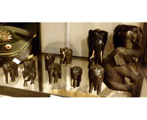 EBONY ELEPHANTS. Shelf of ebony elephant 