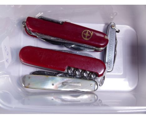 SWISS ARMY PENKNIVES. Two Swiss Army multi blade penknives, Victorian mother of pearl handled multi blade example plus one ot