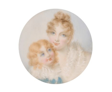 A circular portrait of a Mother and Child in a diamante frame, 1.25" x 1.25".