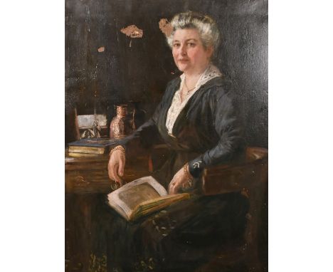 R.B. Ogle, Early 20th Century English School, A portrait of a seated lady reading a book, oil on canvas, signed and dated 192