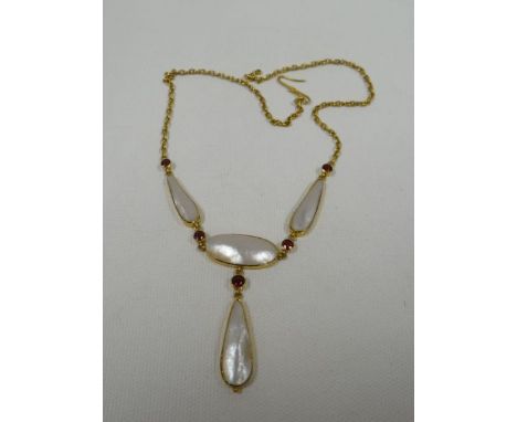 A MOTHER-OF-PEARL & GARNET NECKLACE believed 9ct yellow gold
