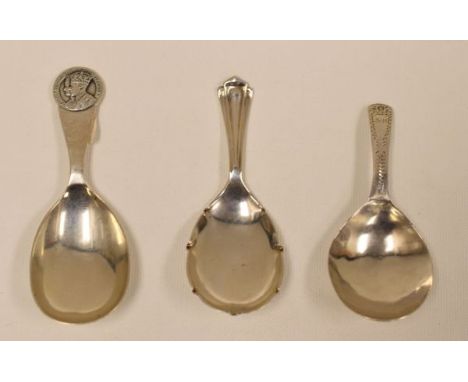 THREE ENGLISH SILVER CADDY SPOONS including Georgian example with engraved decoration, 1937 Commemorative and another, 1.6ozs