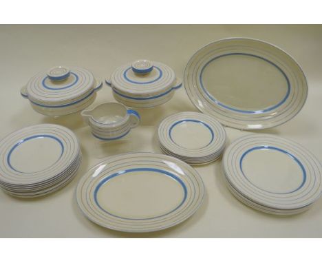 TWENTY-FIVE PIECE CLARICE CLIFF DINNER-SERVICE for Wilkinson with blue banding on a cream ground