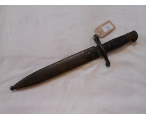 A German WWII bayonet with metal scabbard