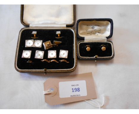 A boxed set of 18ct gold studs and a set of two 18ct gold studs and cufflinks in leather case