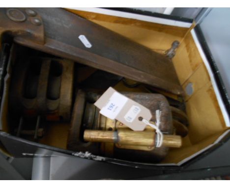 A box of assorted tools and pulleys