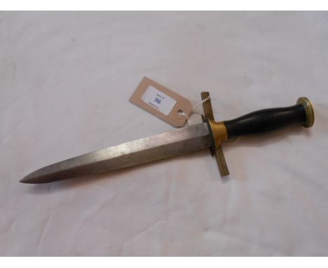 A WWII German dagger having brass hilt with eagle the ebonised handle with bronzed German ensignia 