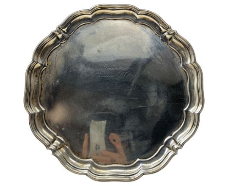 Silver circular salver with piecrust border and presentation inscription on scroll feet D25cm Sheffield 1944 Maker Harrison B