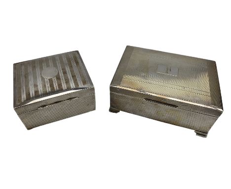 Silver engine turned rectangular cigarette box with engraved initial and bracket feet 13cm x 9cm Birmingham 1959 and another 