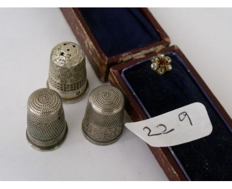 Three silver thimbles and a boxed paste stick pin    