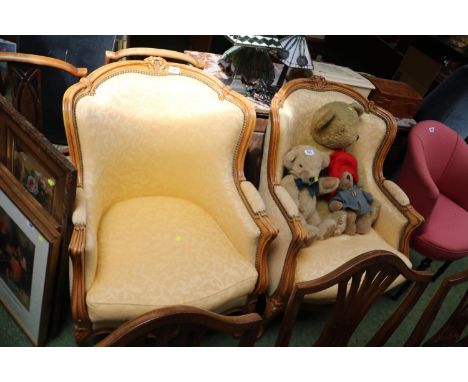 Pair of French style upholstered Elbow chairs with brass button work 