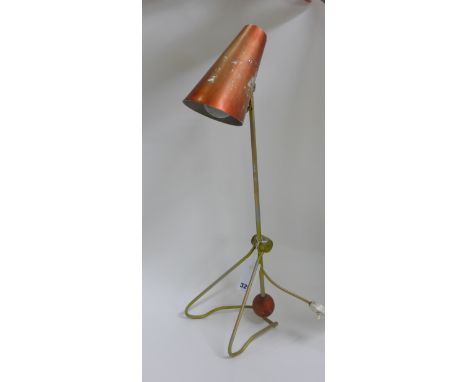 Please Note Amended Designer: A 1950's red enamelled counterweight desk lamp attributed to Merchant Adventurers Ltd, max h. 6