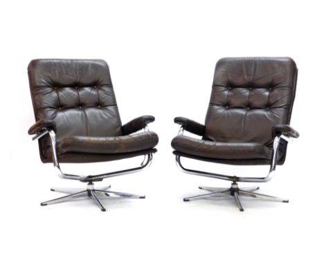A pair of 1970's brown button upholstered lounge armchairs on aluminium five star bases   CONDITION REPORT:  One with repairs