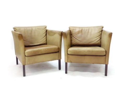 A pair of 1970's light brown leather lounge tub chairs on square feet   CONDITION REPORT:  Poor