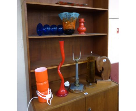 A small group of 1970's and later moulded and art glass together with an oak based table lamp and a teak carving