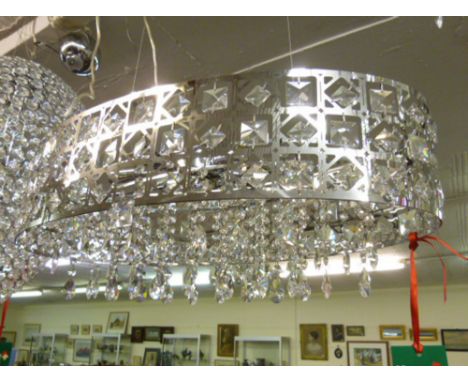 A contemporary oval metal and glass six lamp ceiling light with glass lustres *Please note: VAT @ 20% will be added to the bi