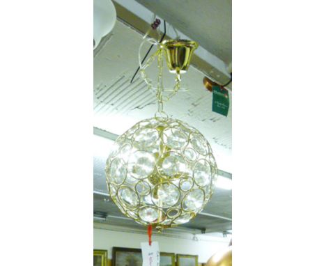 A contemporary spherical brass finished and glass hanging light fitting with six lamps*Please note: VAT @ 20% will be added t
