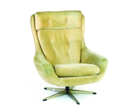 A 1970's draylon and button upholstered swivel chair on an aluminium five star base