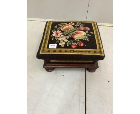 A Victorian mahogany square footstool with a floral tapestry top, 36cm, height 17cm. Condition - good