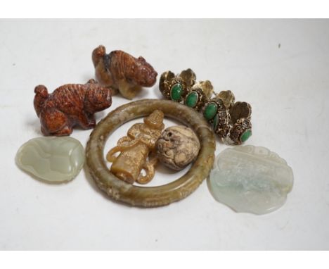 Sixteen Chinese jade and hardstone carvings, including a gilded white metal and jadeite bracelet, three pendants etc. Conditi
