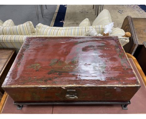A Chinese lacquer trunk, on an associated metal stand, width 84cm, depth 53cm, height 31cm. Condition - poor