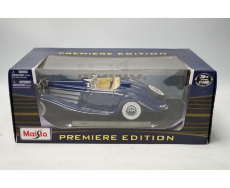 A quantity of diecast vehicles, including Burago, Harley Davidson, Maisto, etc. Condition - varies