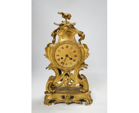 A 19th century French gilt metal mantel clock with Roman numeral dial, no key, pendulum a.f, 35cm high. Condition - fair