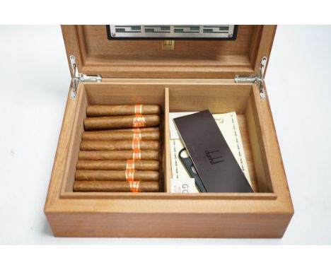 An Alfred Dunhill humidor containing partagas cigars, cutter etc., case 28cm wide. Condition - fair to good