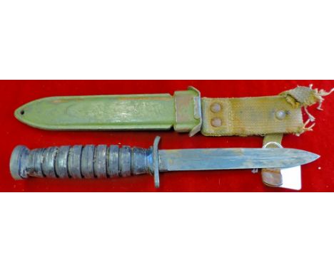 U.S. M3 1943 Fighting Knife with its original scabbard in original condition, slightly distressed. Good