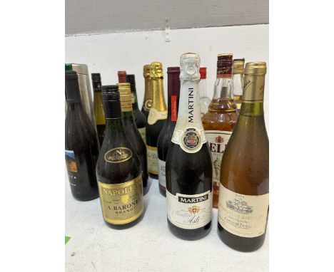 Twenty seven bottles of wine and spirits to include Vodka, Bells Scotch Whisky, Grahams Port, Champagne Location: CRATE Grey 