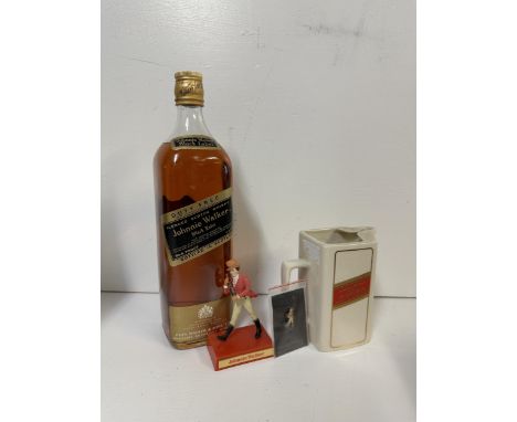 A single bottle of Jonnie Walker Black Label Scotch Whisky, a Jonnie Walker water jug, stick pin and advertising figure,  Loc
