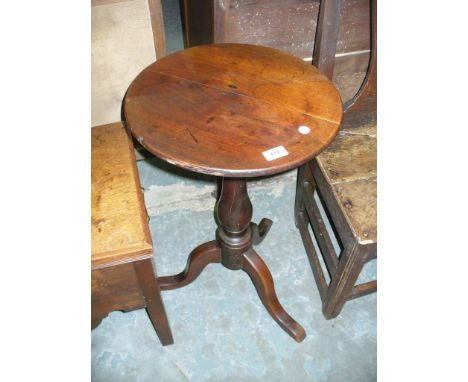 A  19th century circular mahogany tripod table.