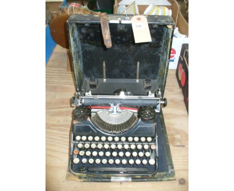 An Earl 20th century cased typewriter.