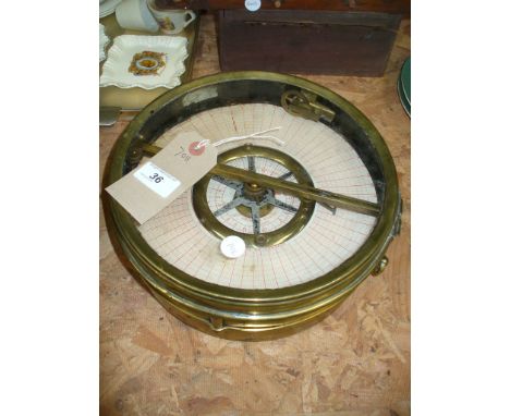 An Early 20th Century brass cased pigeon clock.