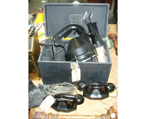 A Boxed long range signalling lamp and a pair of vintage internal telephones.