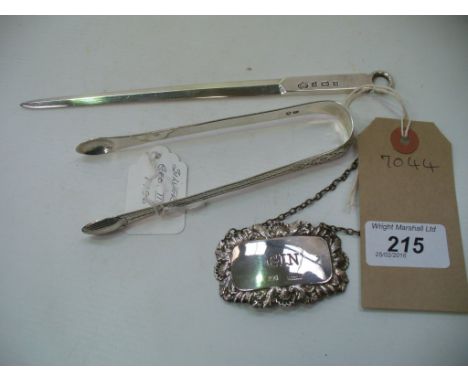 A Silver " Gin " decanter label, a Georgian pair of silver sugar tongs and a silver letter knife, Birmingham 1968. (3)