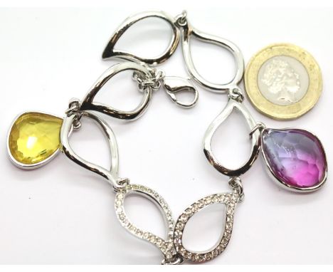 Boxed Swarovski bracelet with purple and yellow stones. P&amp;P Group 1 (£14+VAT for the first lot and £1+VAT for subsequent 