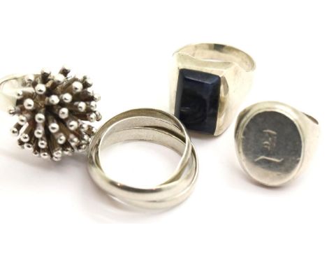 Four silver rings, mixed sizes. P&amp;P Group 1 (£14+VAT for the first lot and £1+VAT for subsequent lots) 